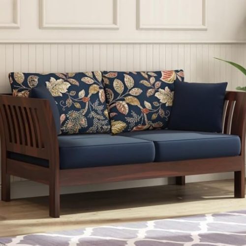 Solid wooden two seater sofa with floral printed cushions and walnut finish for living room décor