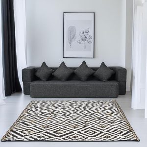 Modern black folding couch bed with cushions in a minimalist living room