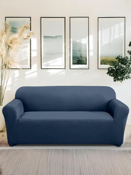 Modern living room with a navy blue stretchable sofa couch cover