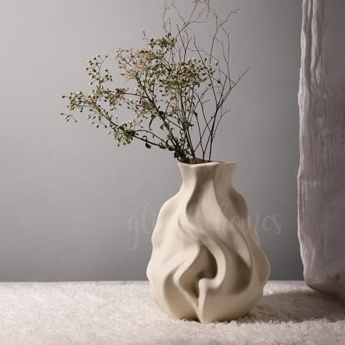 Ceramic Whispering Vase in off-white matte finish with dried flowers, artistic home décor accent.