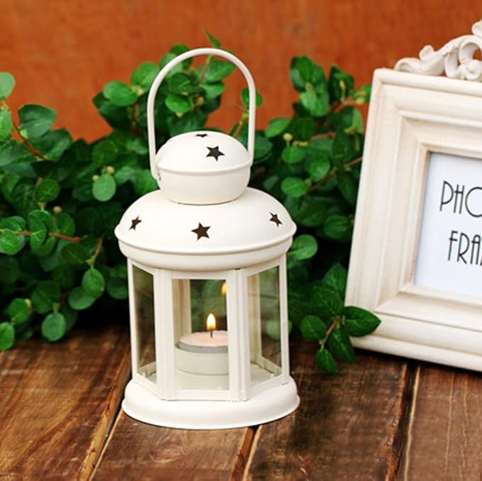 White Metal Lantern Decoration with star cut design, tea light candle holder for home décor and festive decoration.
